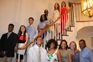 Forrestine Coombs, Erin Coombs and Eric Coombs pose with some of the 17 class of 2018 scholarship award winners.